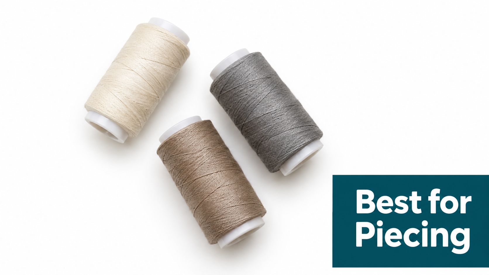 Three spools of sewing thread in cream, brown, and grey colors arranged on a white background.