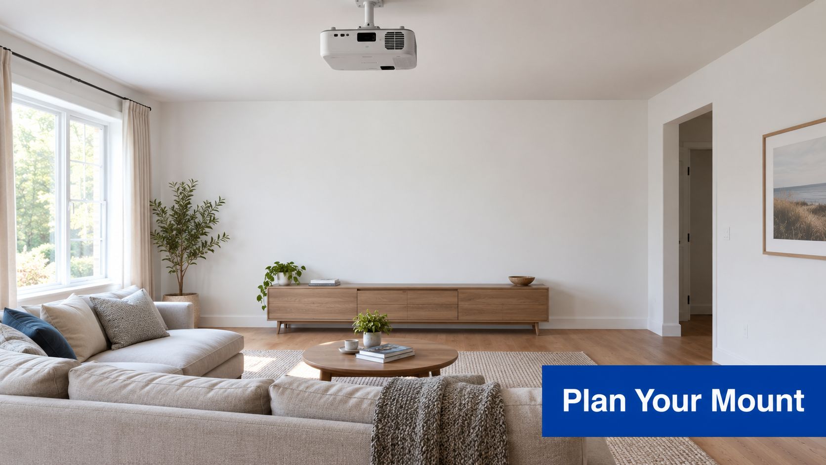 A modern living room with a ceiling-mounted projector positioned above a minimalist wooden media console and sofa.