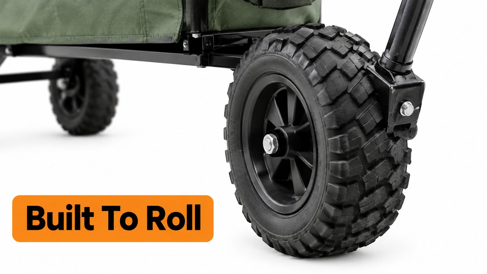 A close-up view of the rugged, off-road wheels of a green foldable push and pull utility wagon.