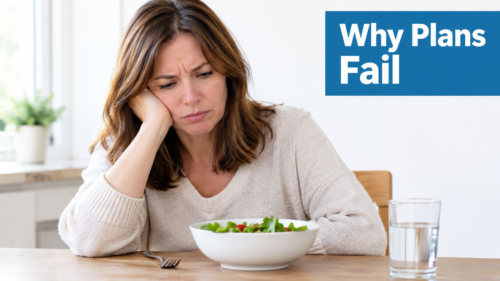 A sad woman sitting at a table looking unenthusiastic about her bowl of fresh salad for dinner.