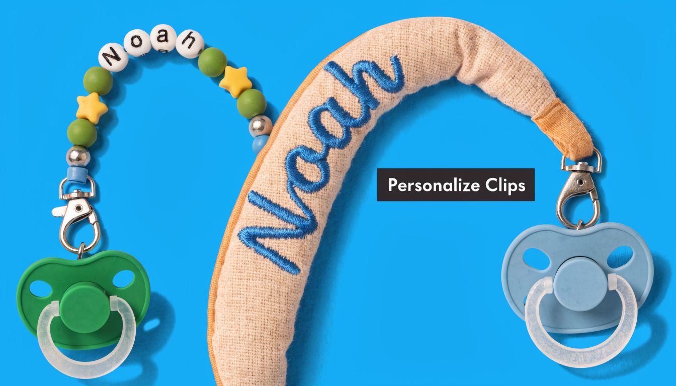Two personalized baby pacifier clips with the name Noah on a bright blue background.