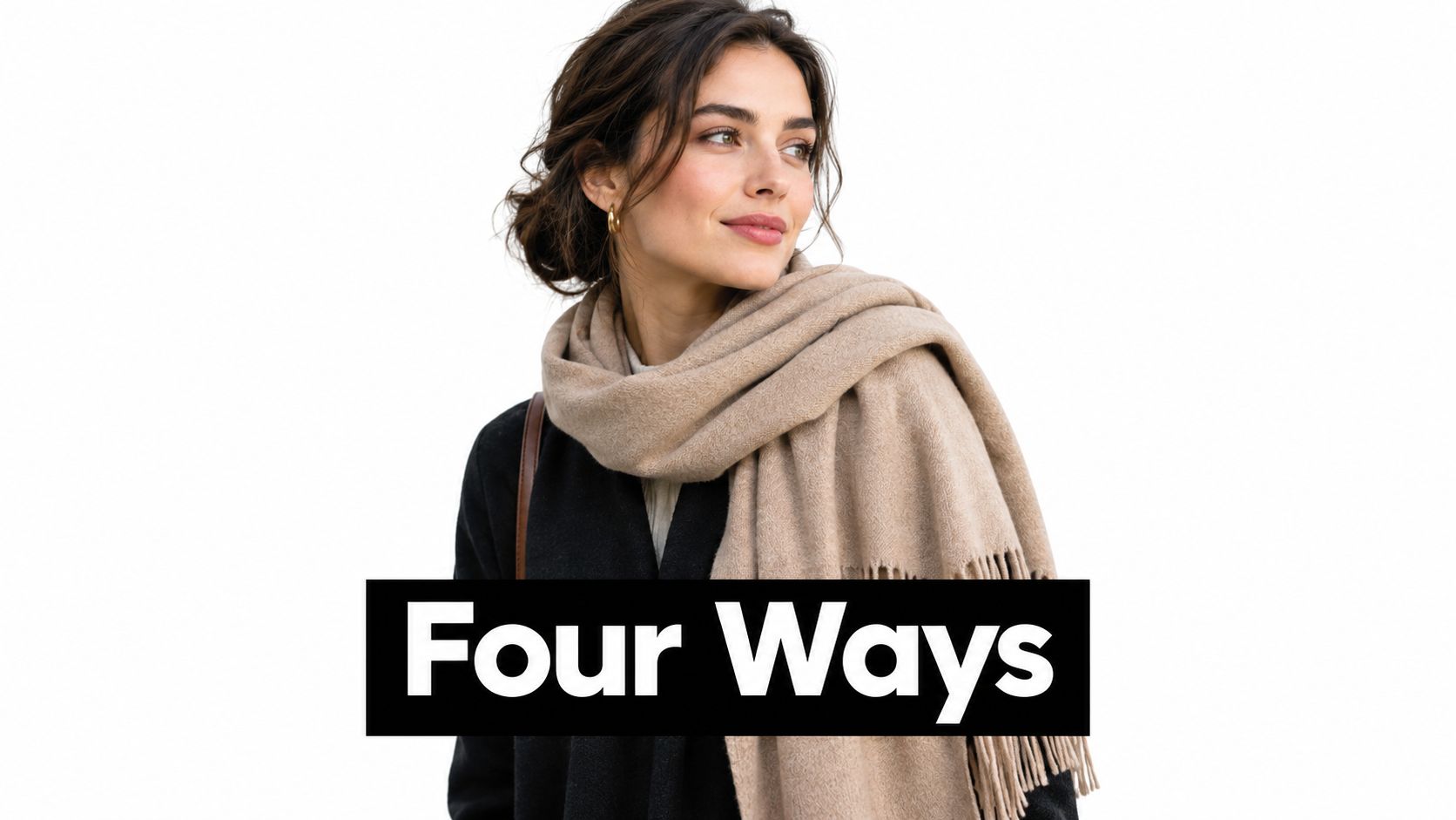 A woman wearing a beige scarf over a black coat looking to the side in studio lighting.