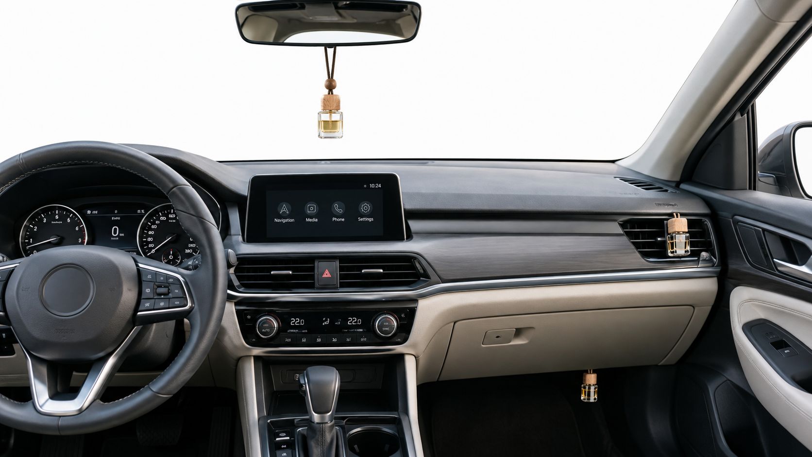 A modern car interior featuring a hanging essential oil air freshener bottle attached to the rearview mirror.