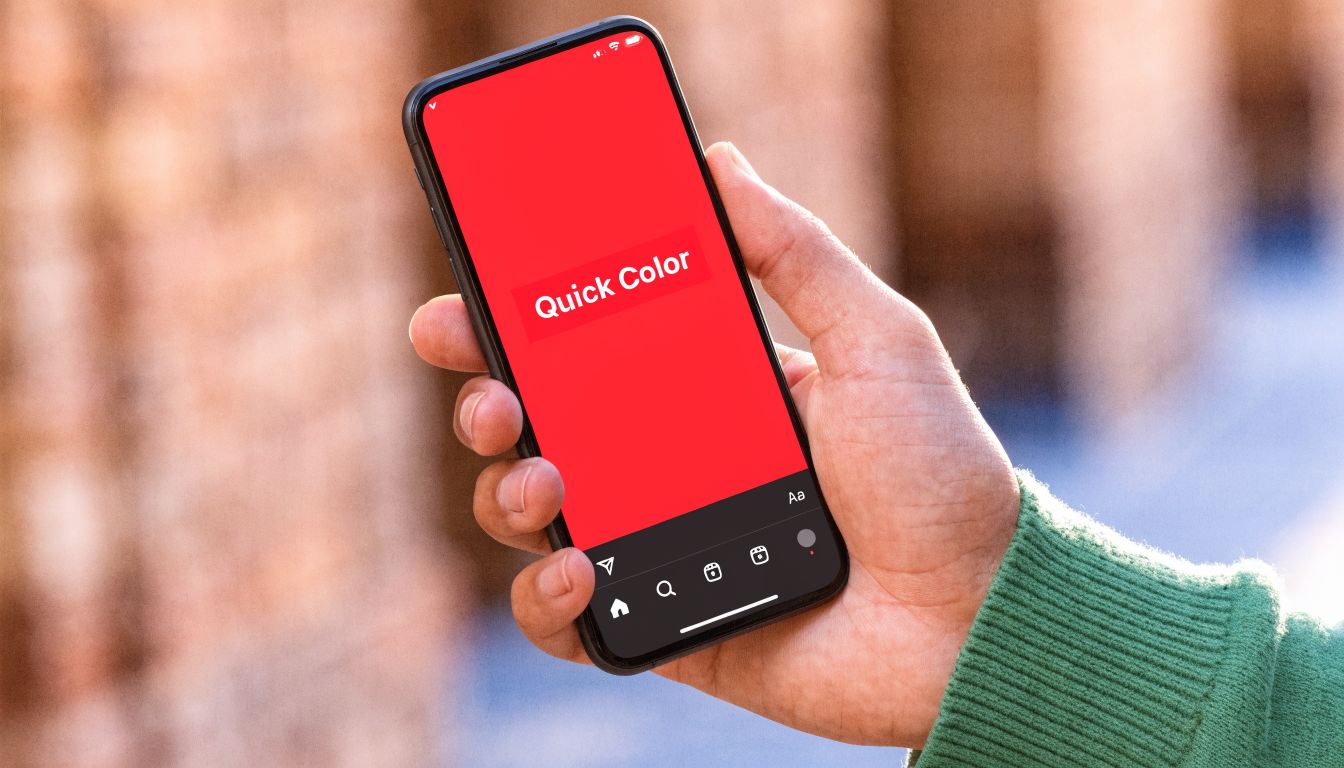 A person holding a smartphone showing an Instagram story screen with a solid red background color.