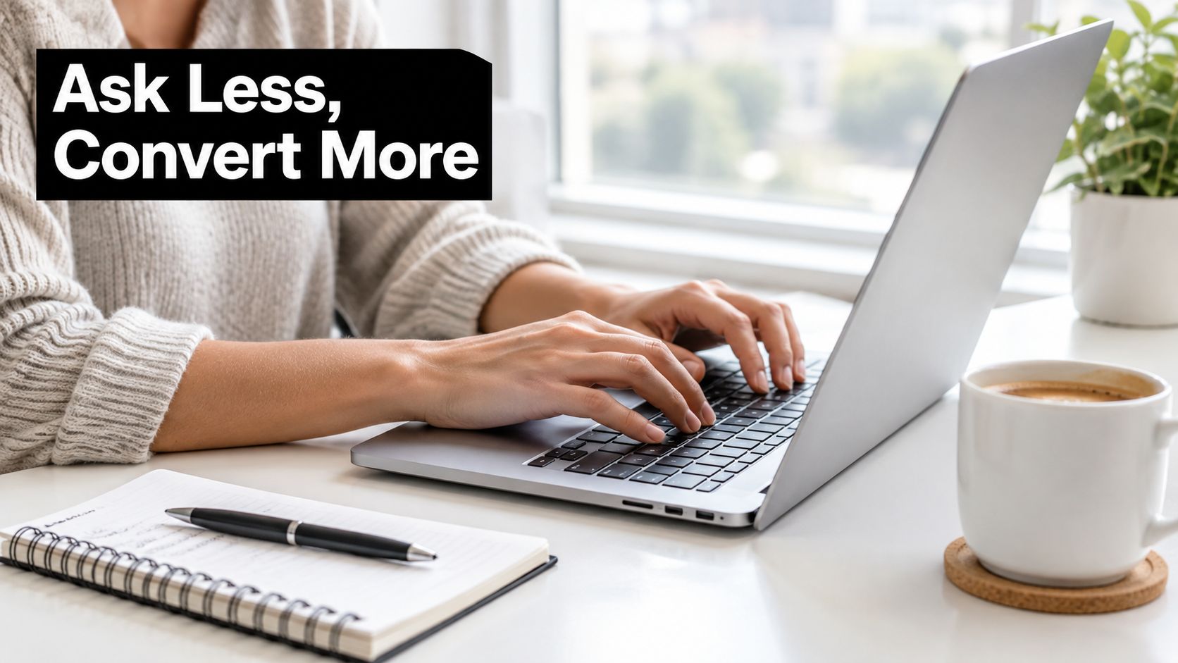 A person typing on a laptop with a pen and notebook, emphasizing landing page form design strategies.