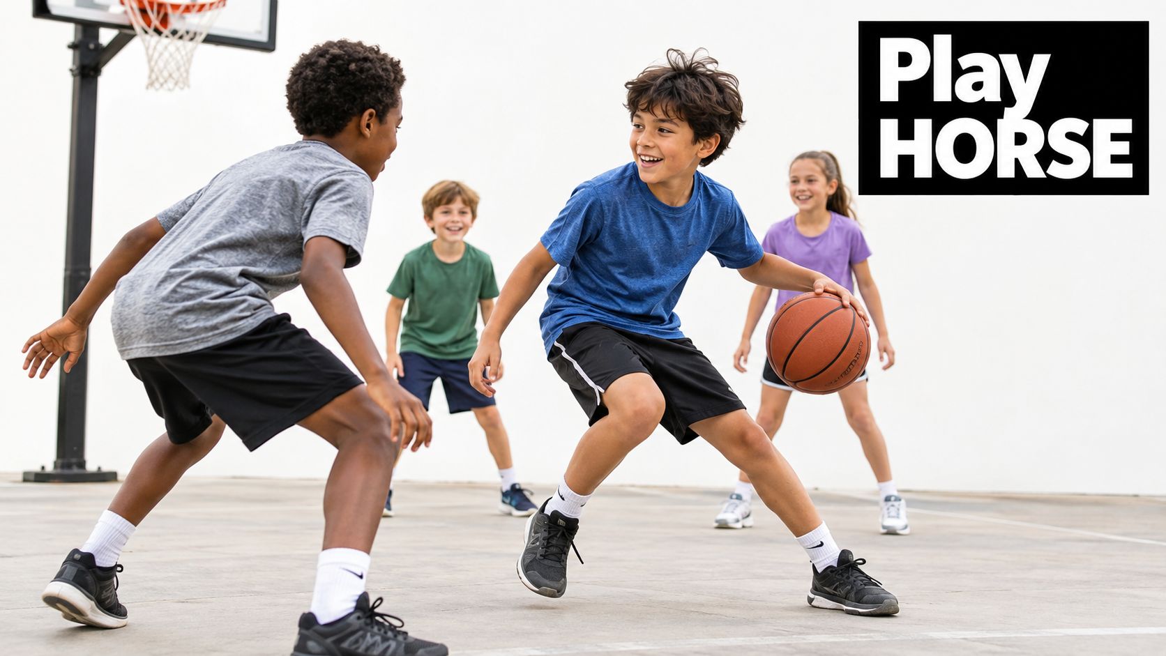 A group of happy, diverse children playing a fun game of basketball on an outdoor court.