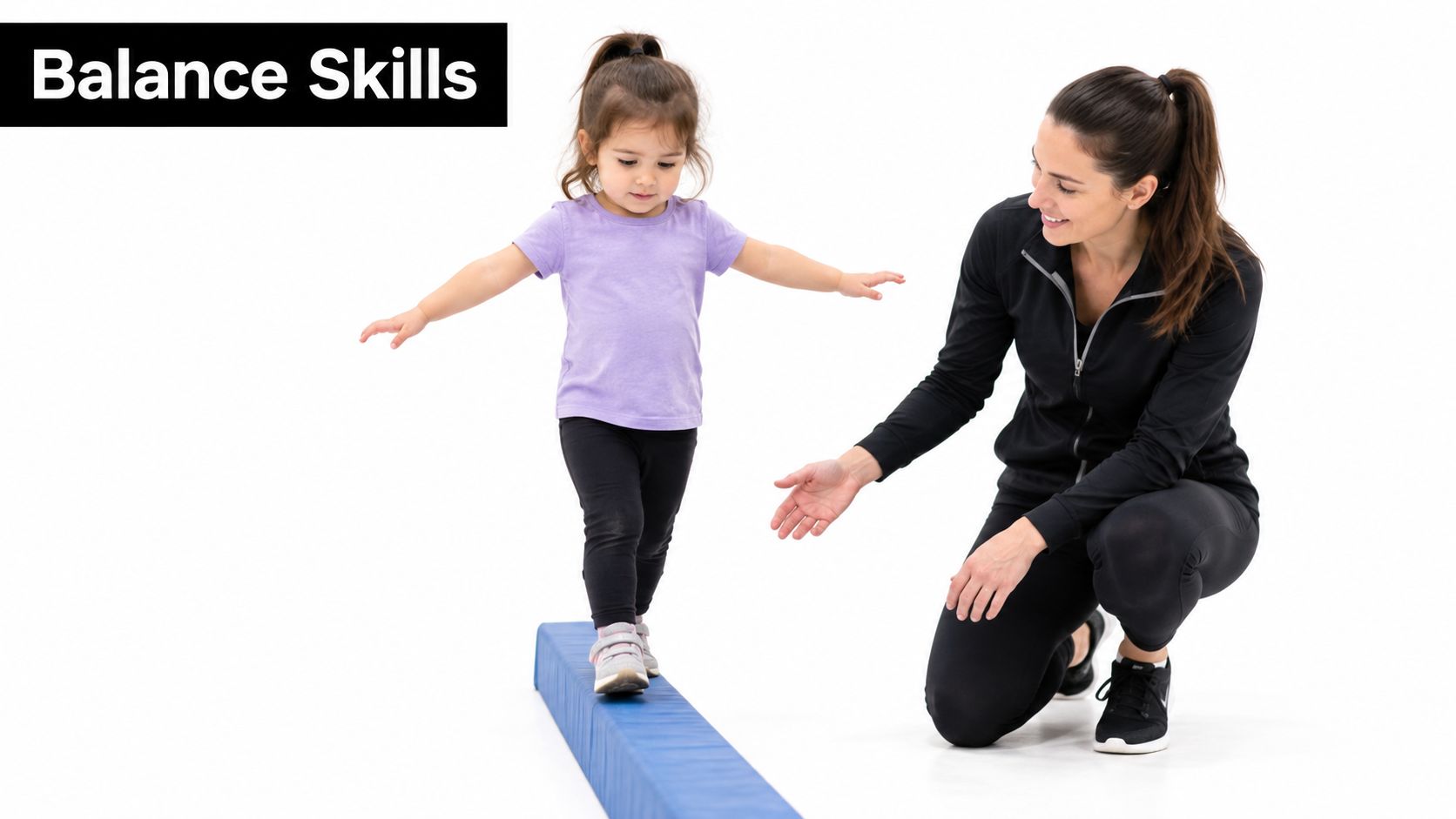 A young girl balances on a blue beam while a female instructor watches and provides encouragement.