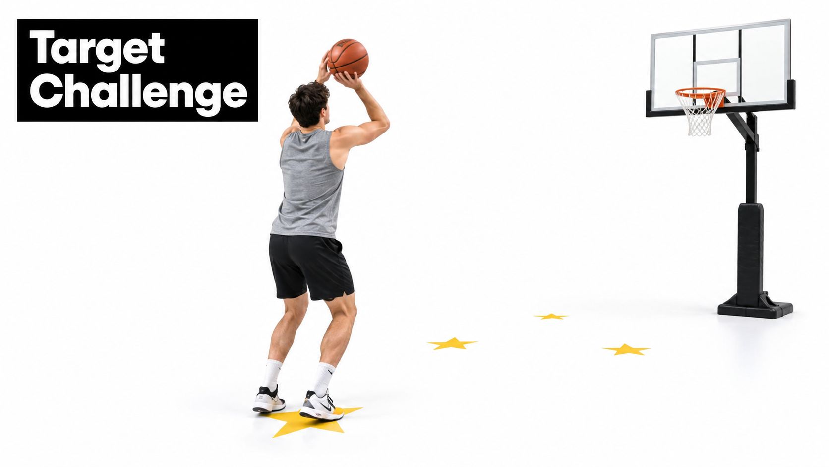 A man in athletic wear preparing to shoot a basketball towards a hoop with target stars on floor.