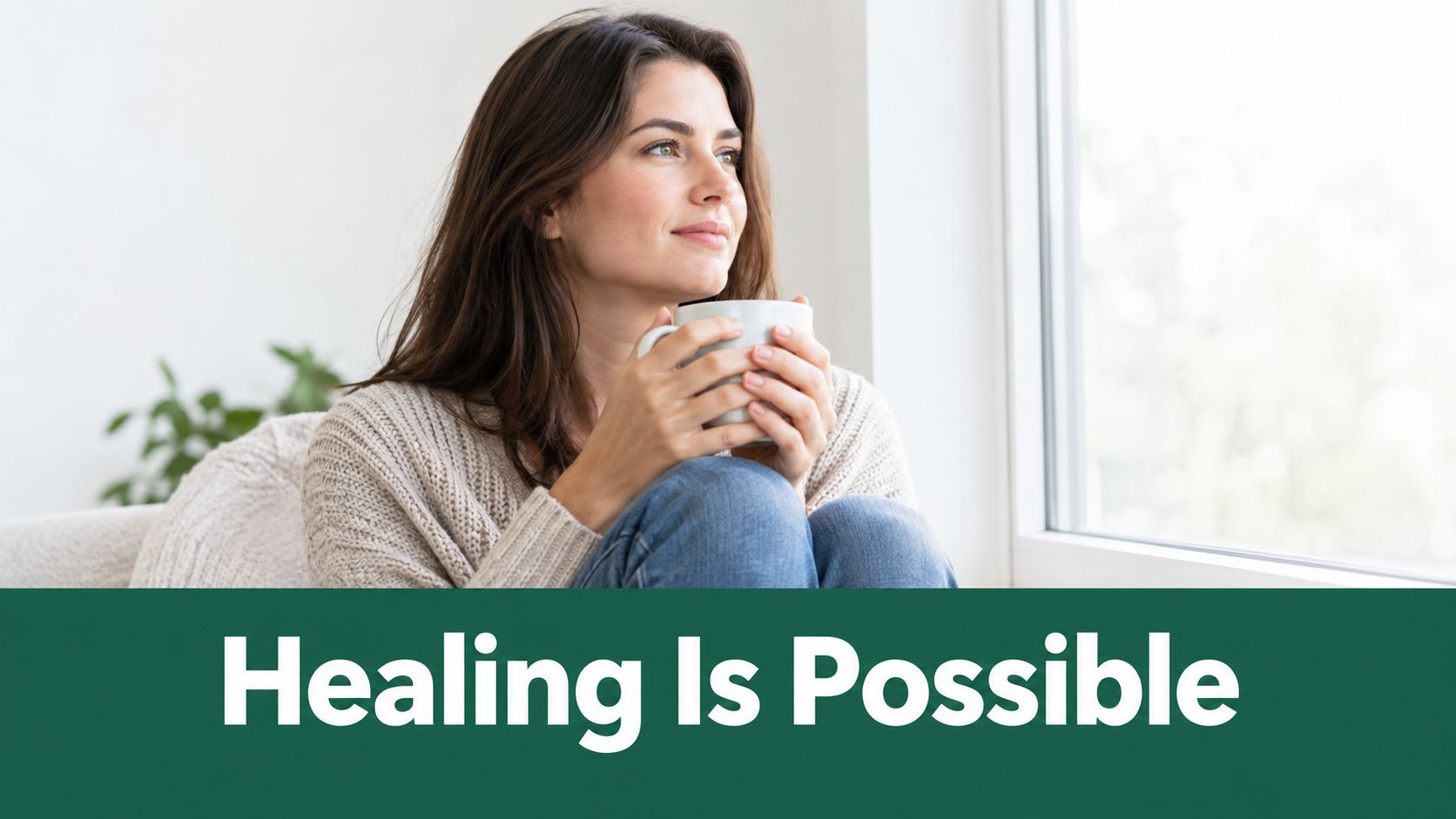A calm woman holding a coffee mug while looking out the window with the text Healing Is Possible.
