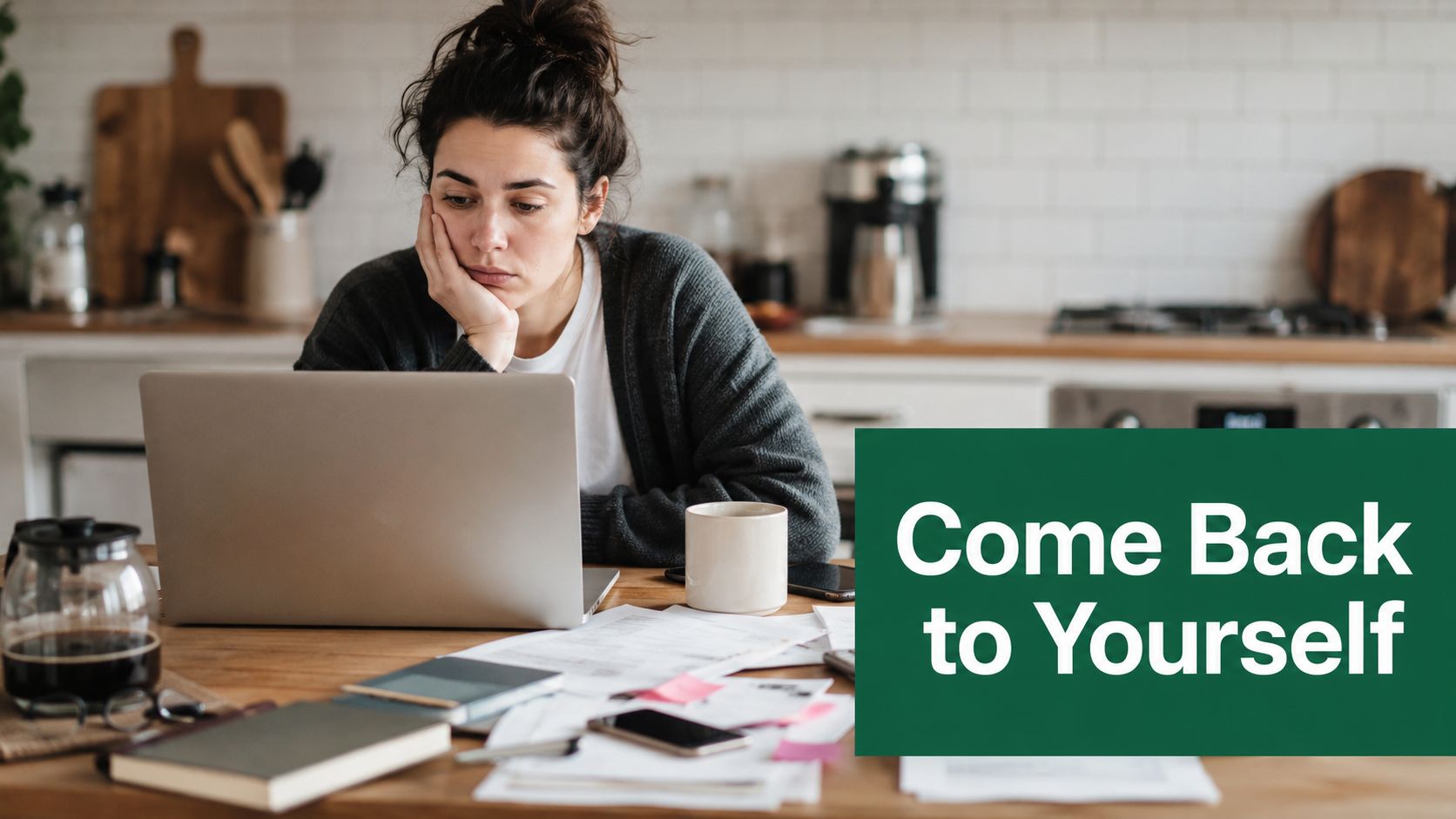 A tired woman working on a laptop at a kitchen table with the words Come Back to Yourself.