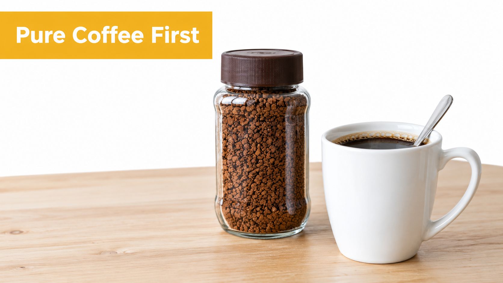 A glass jar of instant coffee granules next to a white cup of black coffee on wood.