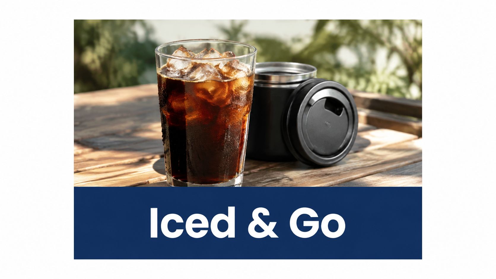 A glass of iced black coffee next to a black travel tumbler on a wooden table.
