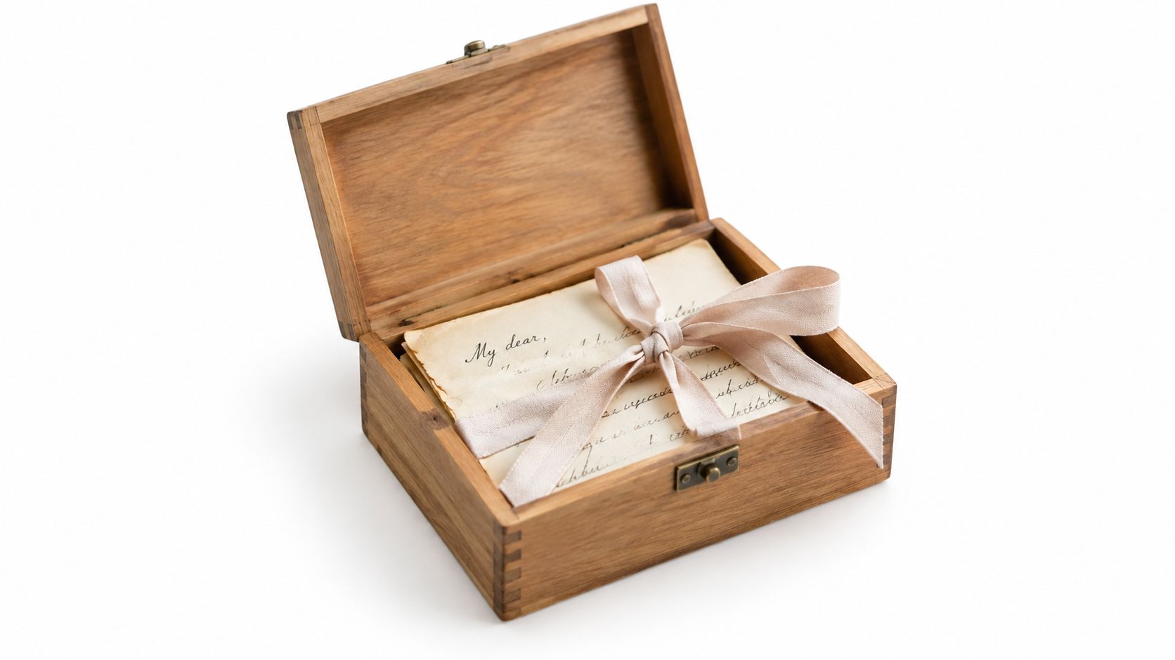 A rustic wooden box holding vintage handwritten letters tied together with a delicate light pink ribbon.