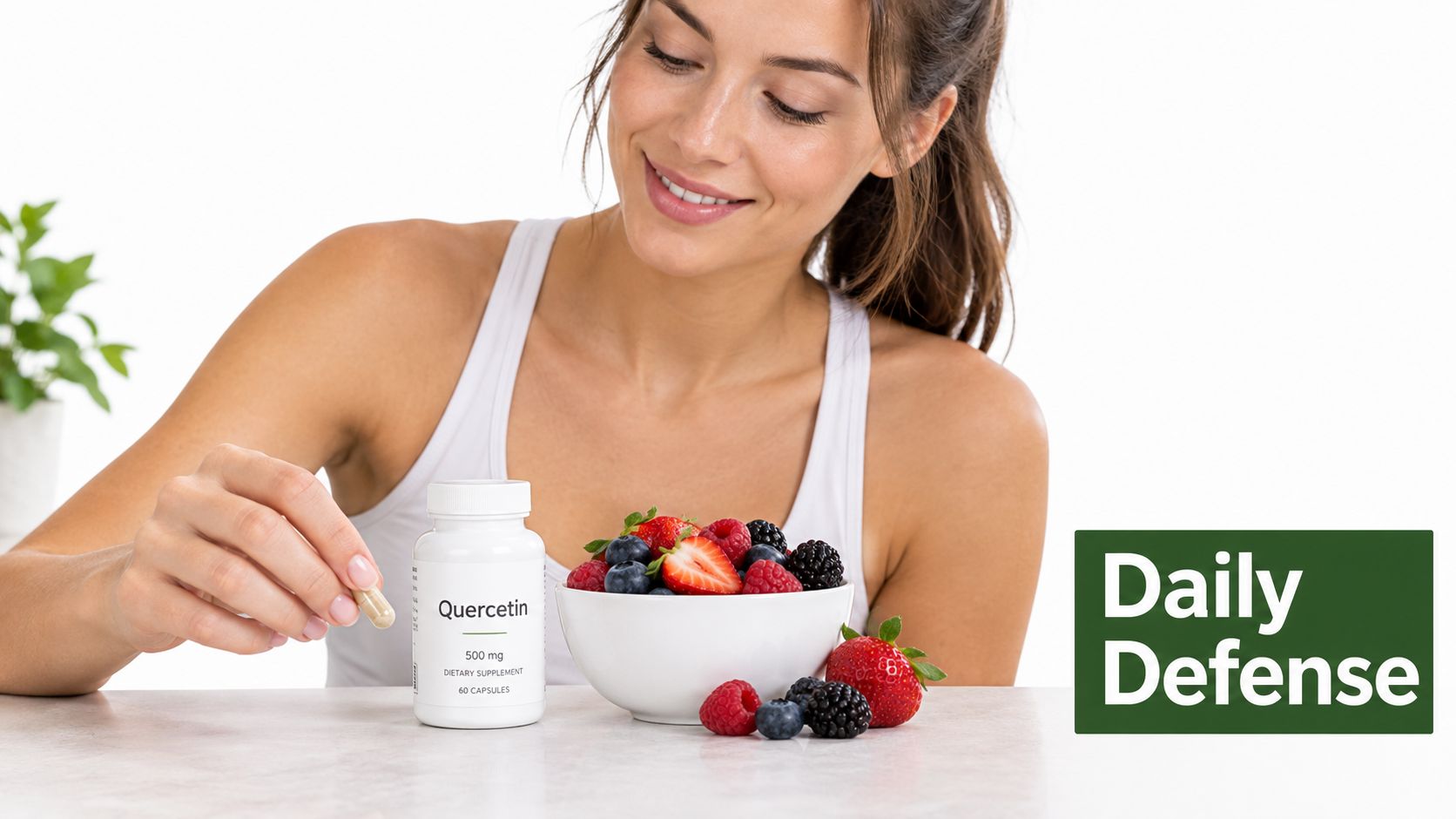 A woman holding a quercetin capsule next to a bowl of fresh berries on a table.