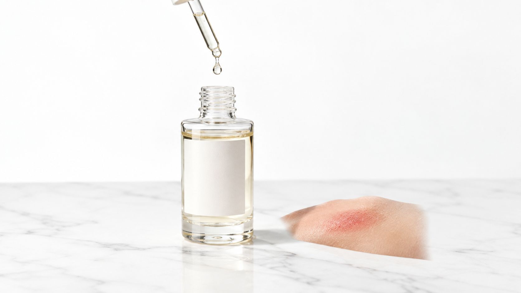 A clear serum bottle with a dropper above it next to a patch of skin showing hyperpigmentation.