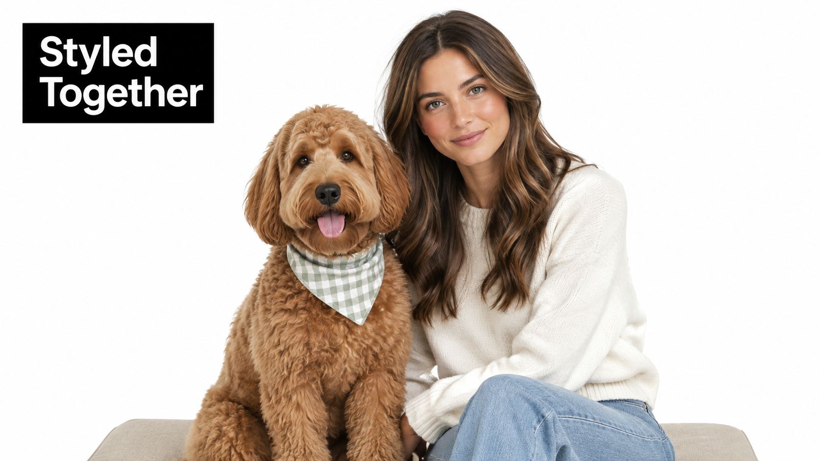 A woman with long wavy brown hair posing next to her curly golden dog wearing a bandana.