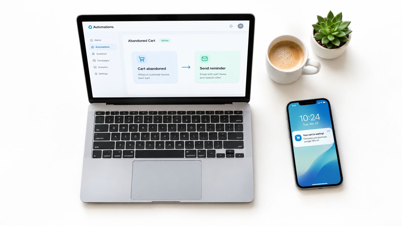 A laptop and smartphone displaying marketing automation software for an abandoned shopping cart email campaign.