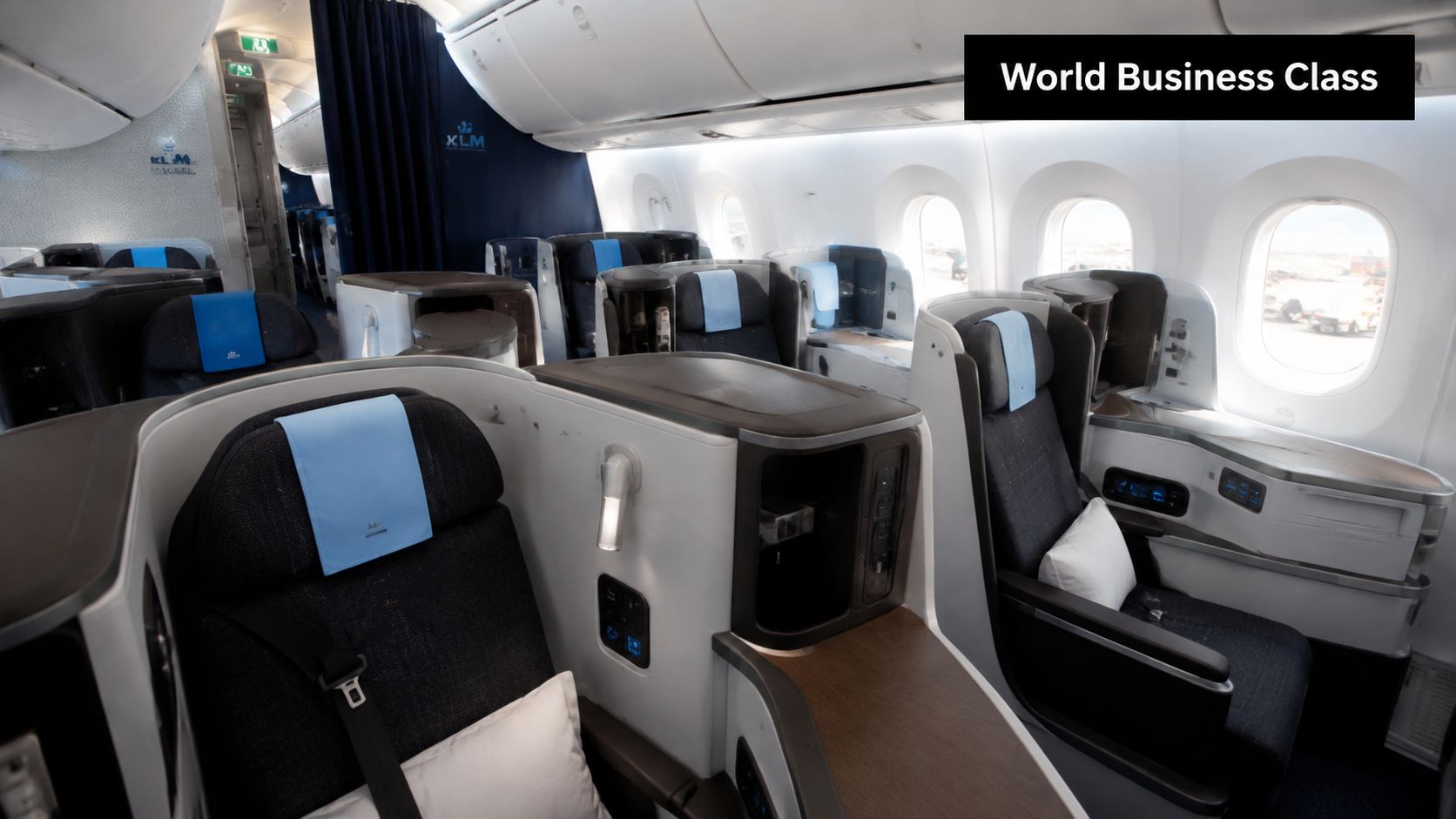 Modern and comfortable business class seats arranged in the cabin of a KLM commercial airplane