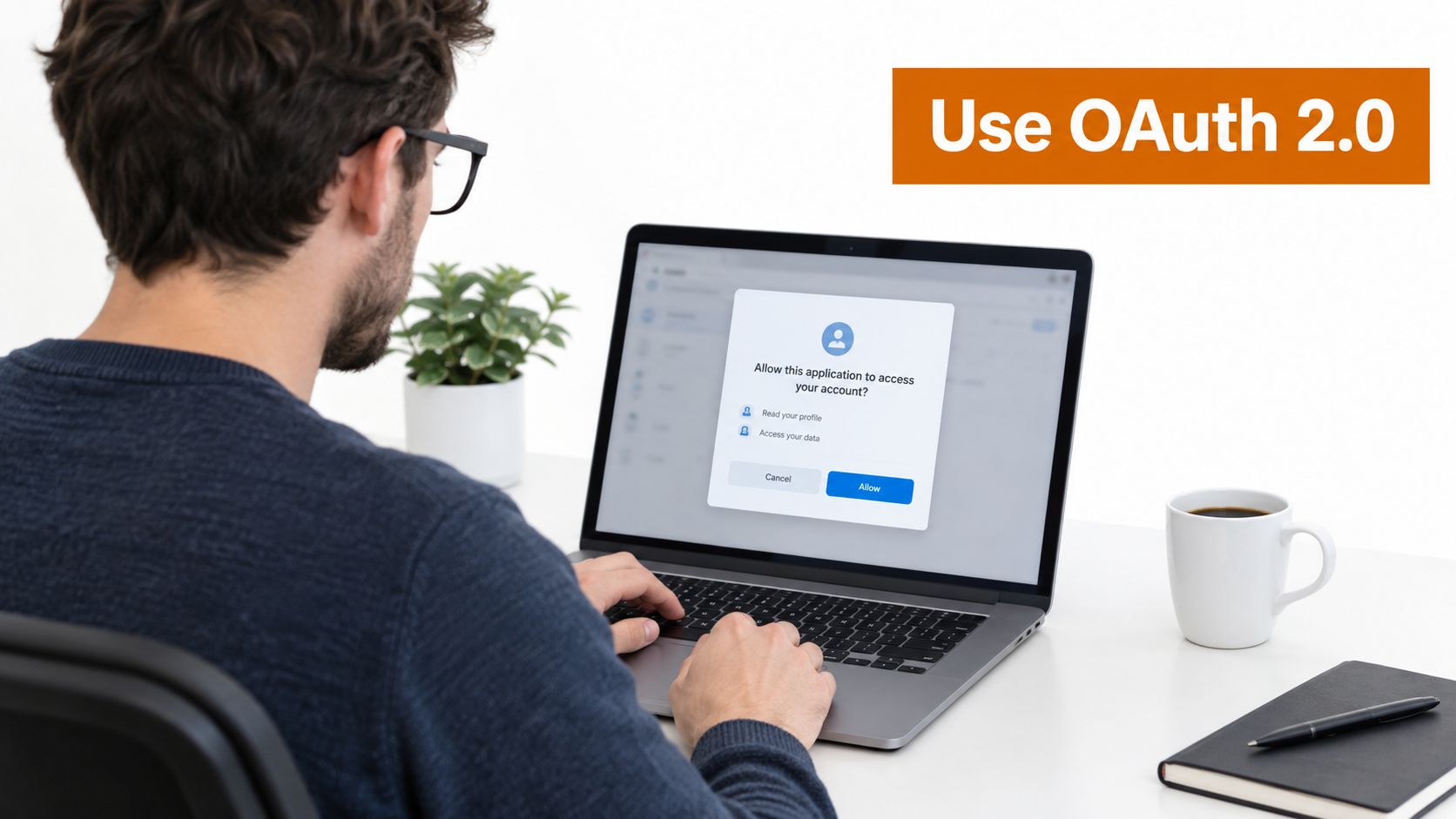 A man working on his laptop while navigating an OAuth 2.0 account authorization permission prompt dialog.