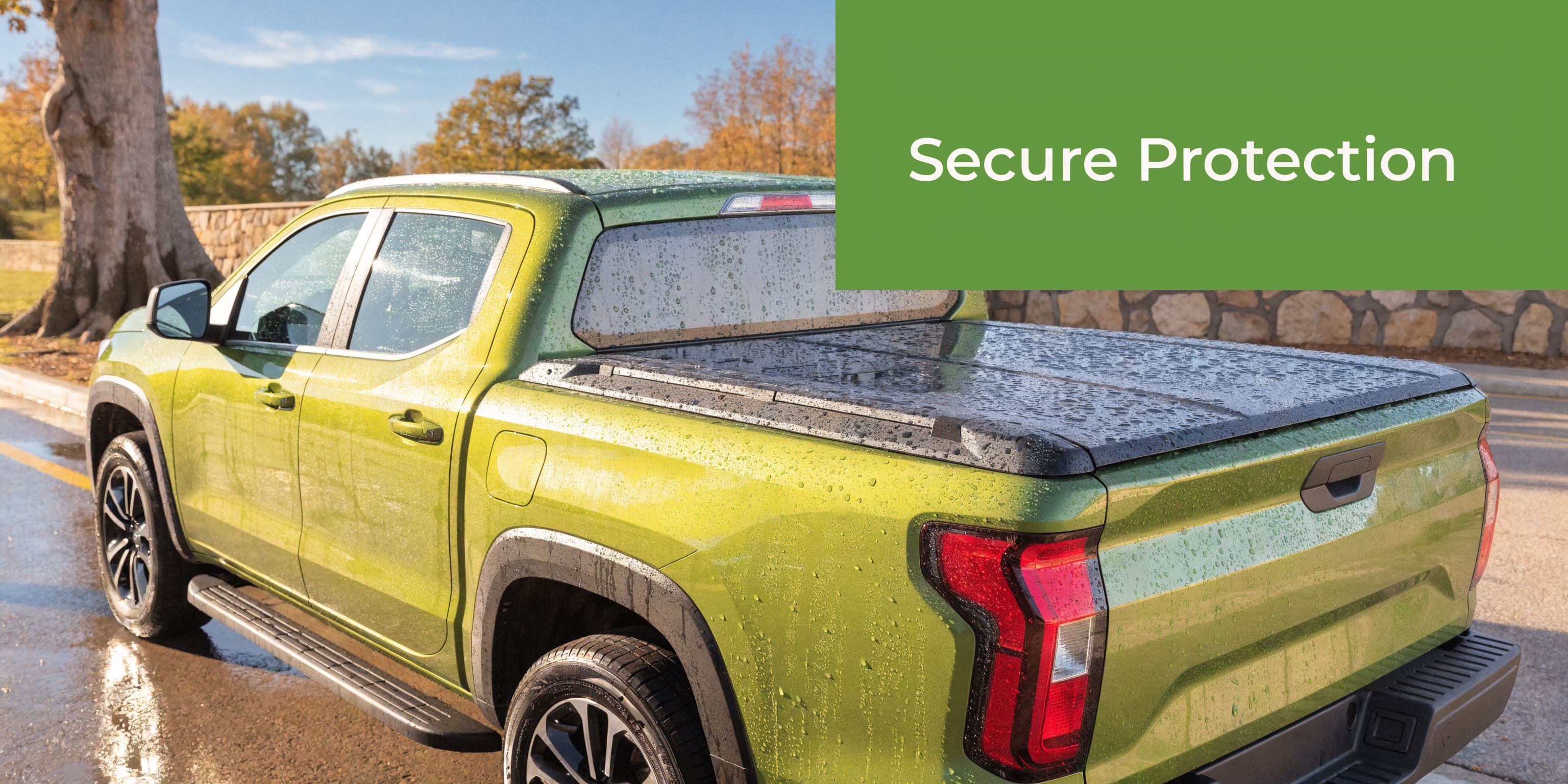 A lime green pickup truck with a black hard folding tonneau cover parked outdoors on a rainy day.