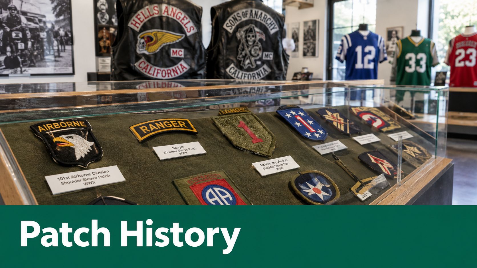 A display case containing various historic military shoulder sleeve patches from World War II in a museum.