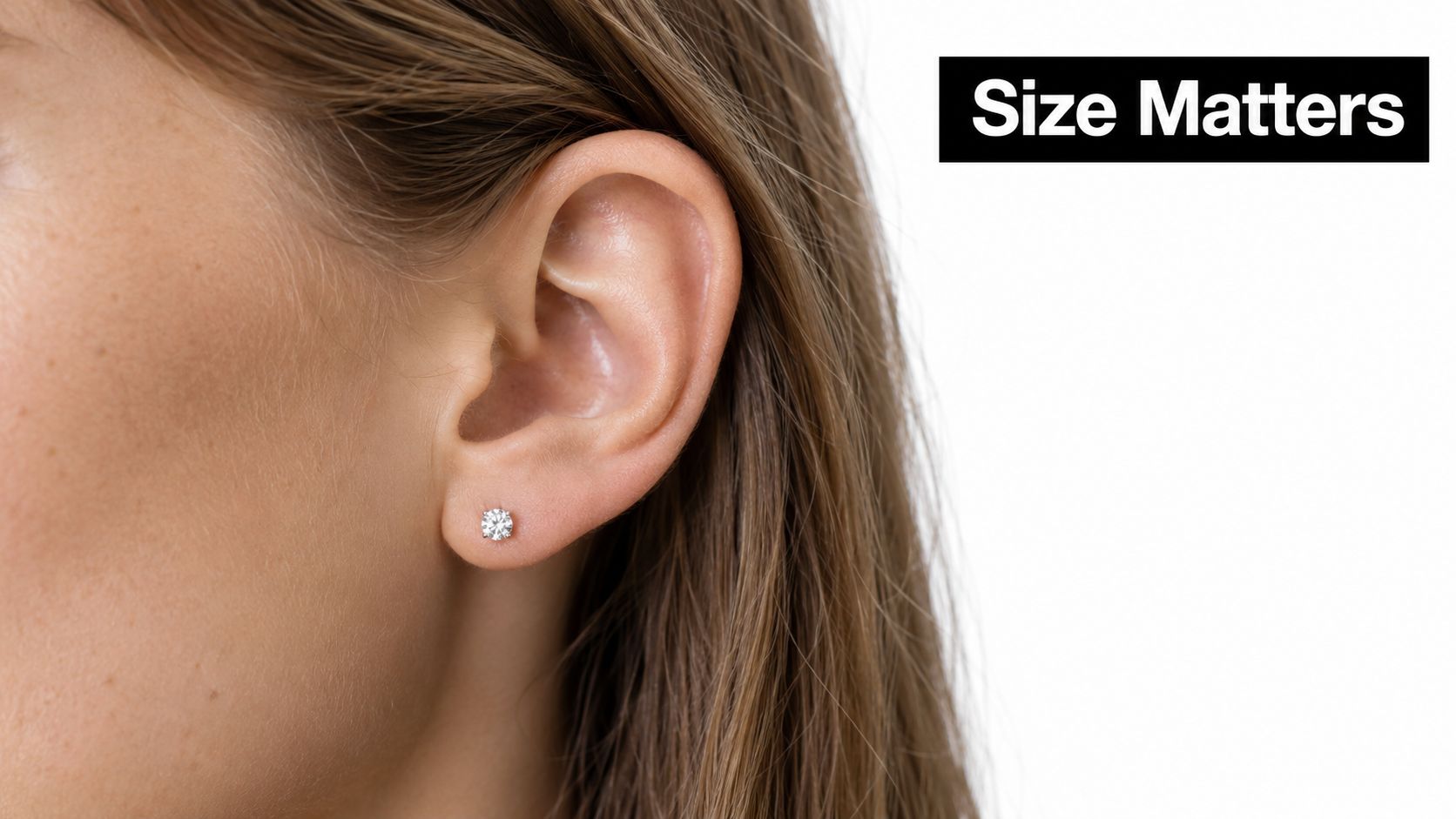 A close-up view of a woman wearing a delicate 0.5 carat diamond stud earring in her earlobe.