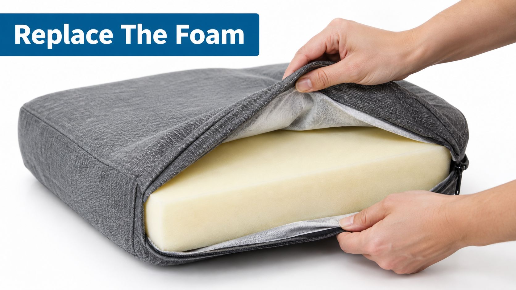A person opening a grey fabric couch cushion cover to reveal the yellow foam cushion inside.