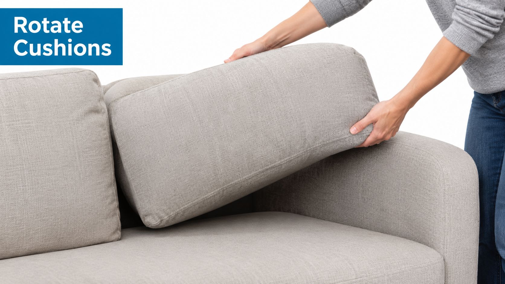 A person rotates a grey couch cushion as part of routine sofa maintenance tips for longevity.