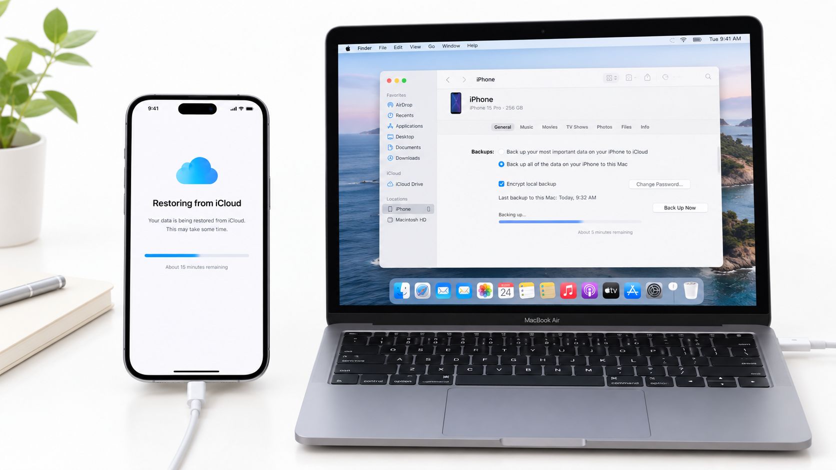 An iPhone screen shows data restoring from iCloud while a MacBook backs up the device via cable.