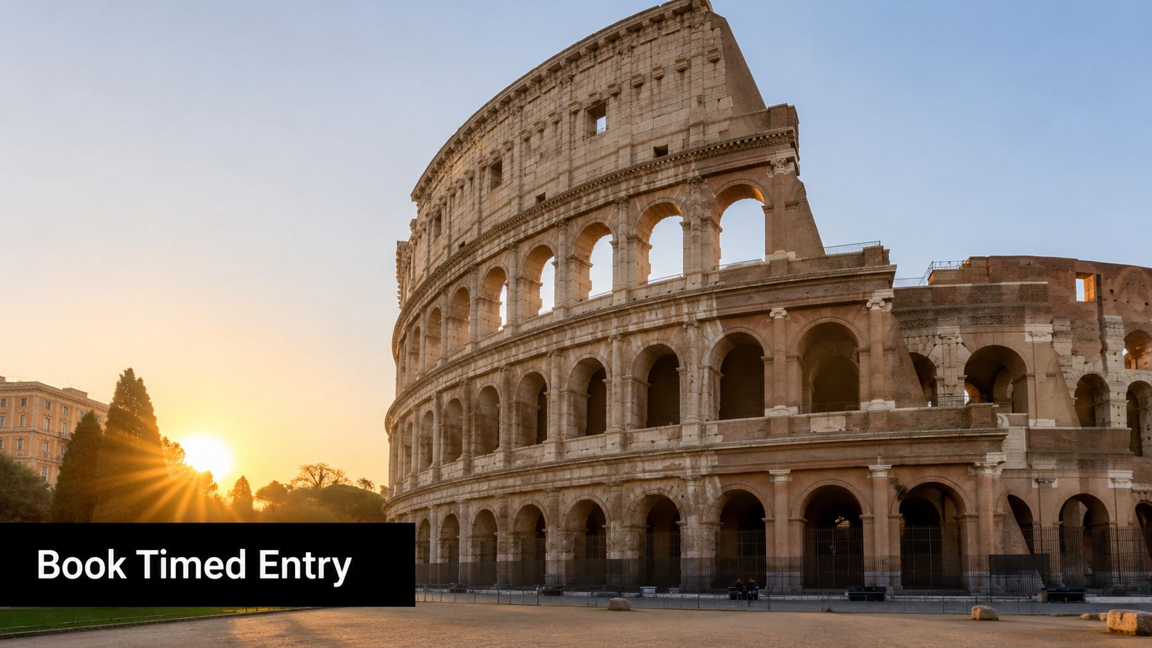 The Colosseum in Rome during a beautiful golden sunset with a clear sky in the background.