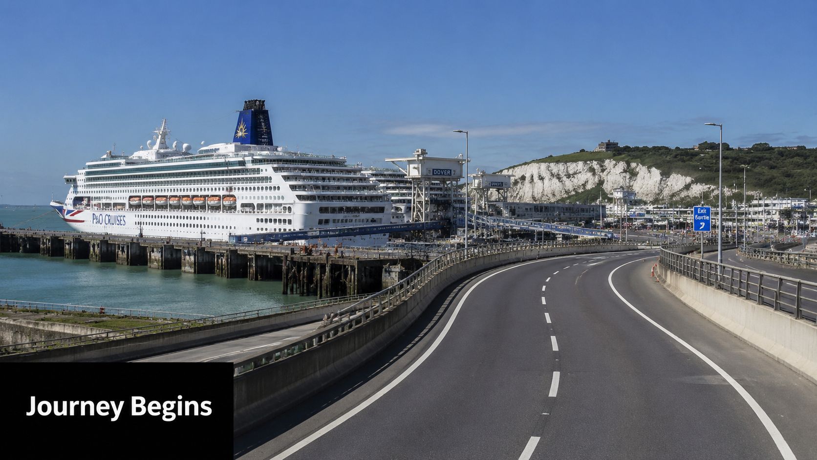 A large P&O cruise ship docked at the Port of Dover with white cliffs in the background.