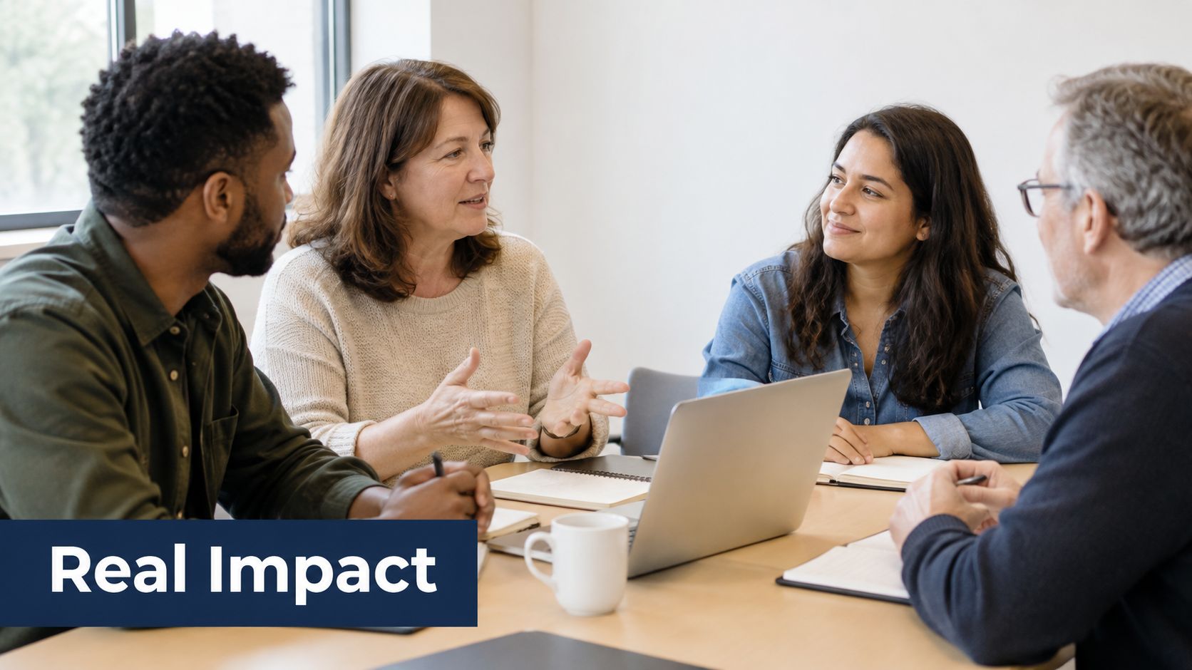 A diverse group of professionals collaborates around a table while discussing ideas in a modern office meeting.