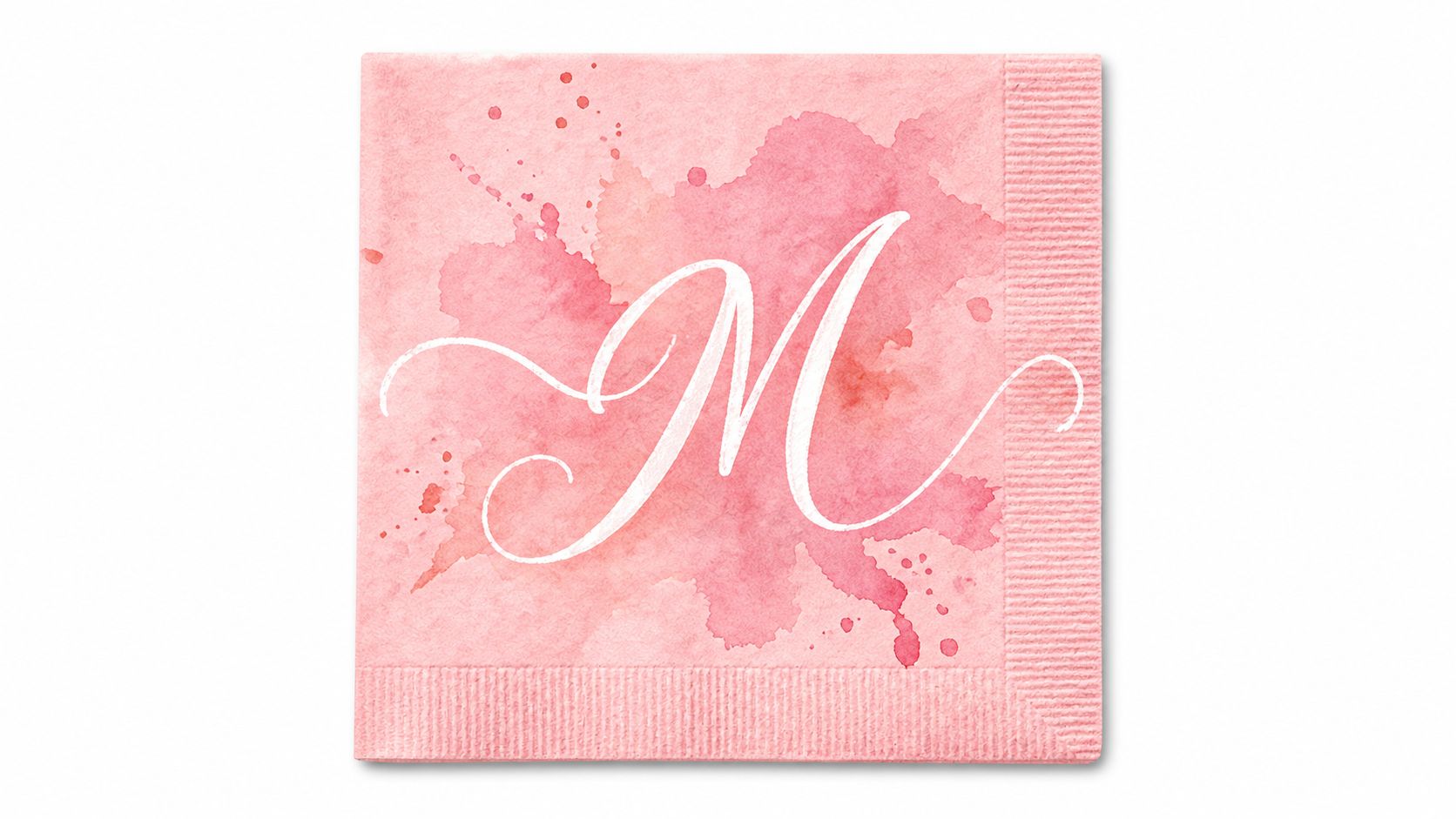 A square pink watercolor paper napkin featuring an elegant white calligraphic monogram letter M in the center.