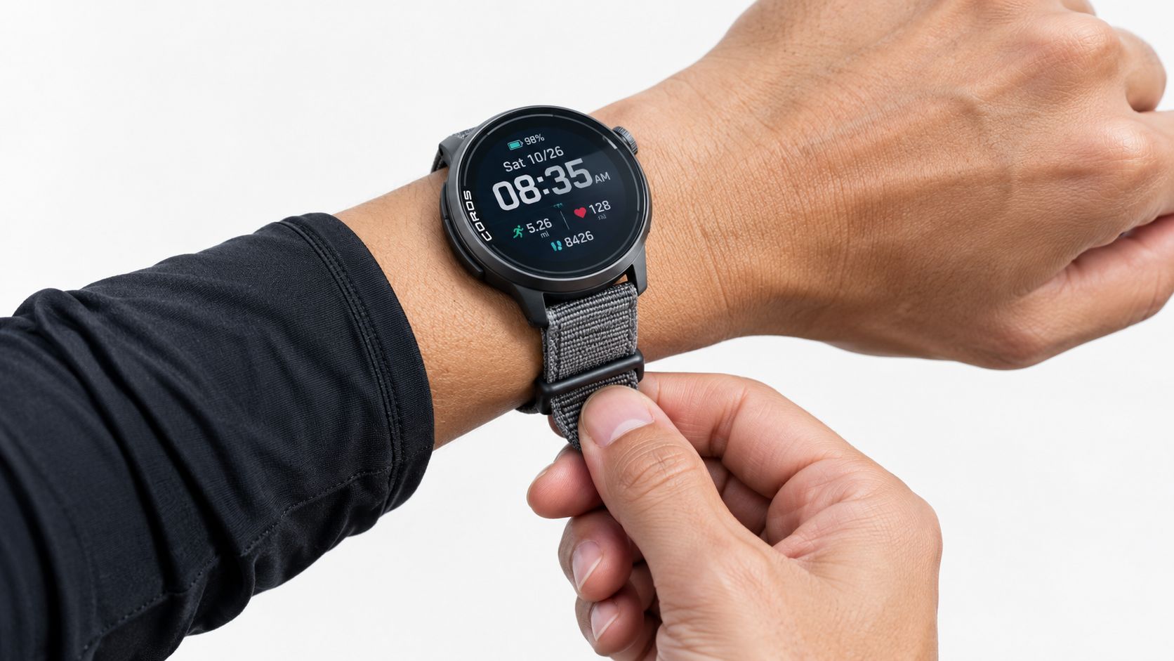 A close-up shot of a wrist wearing a Coros sports watch with a grey nylon strap.