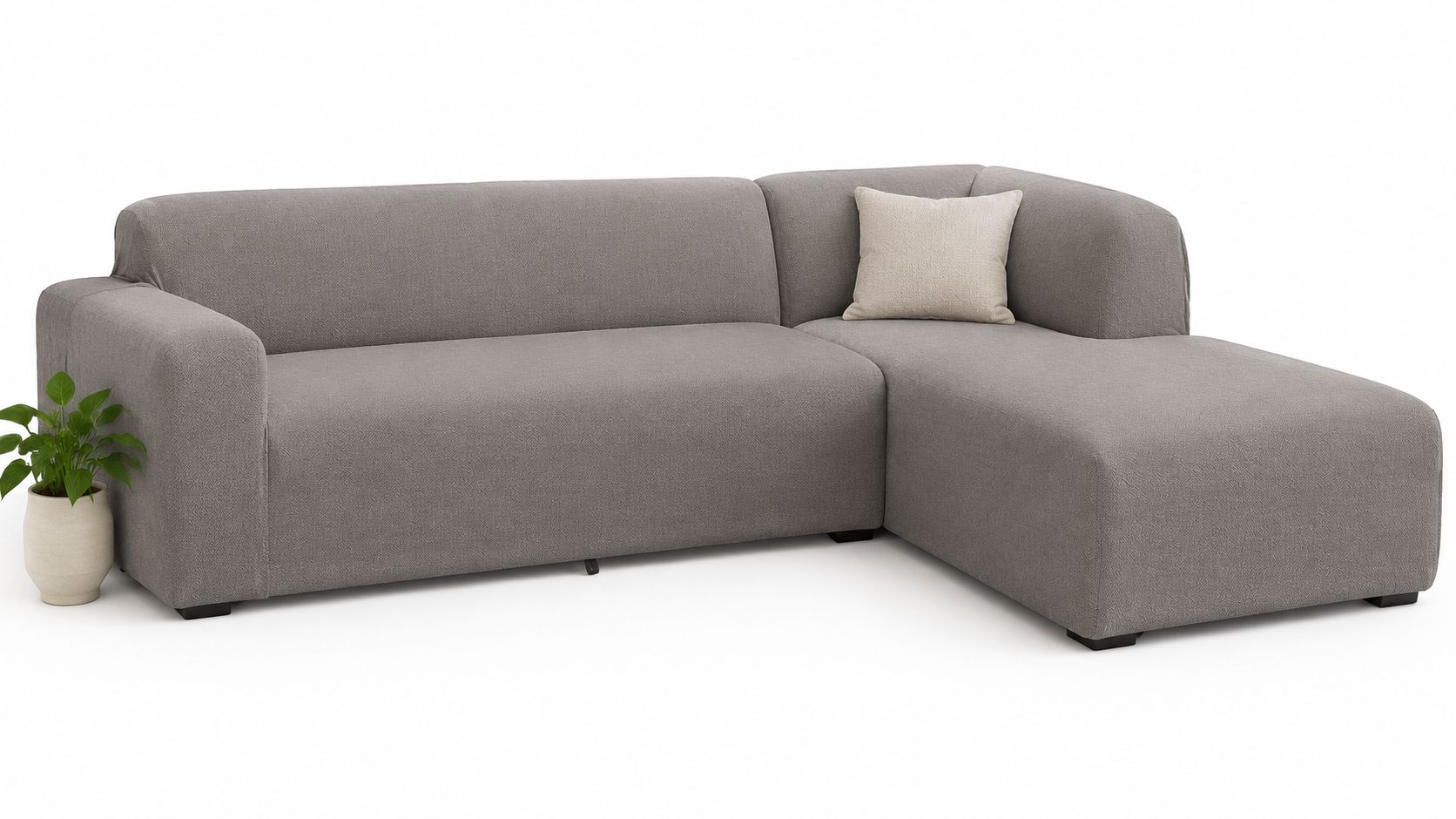 A minimalist modern gray sectional sofa with a soft cream-colored accent pillow against a white background.