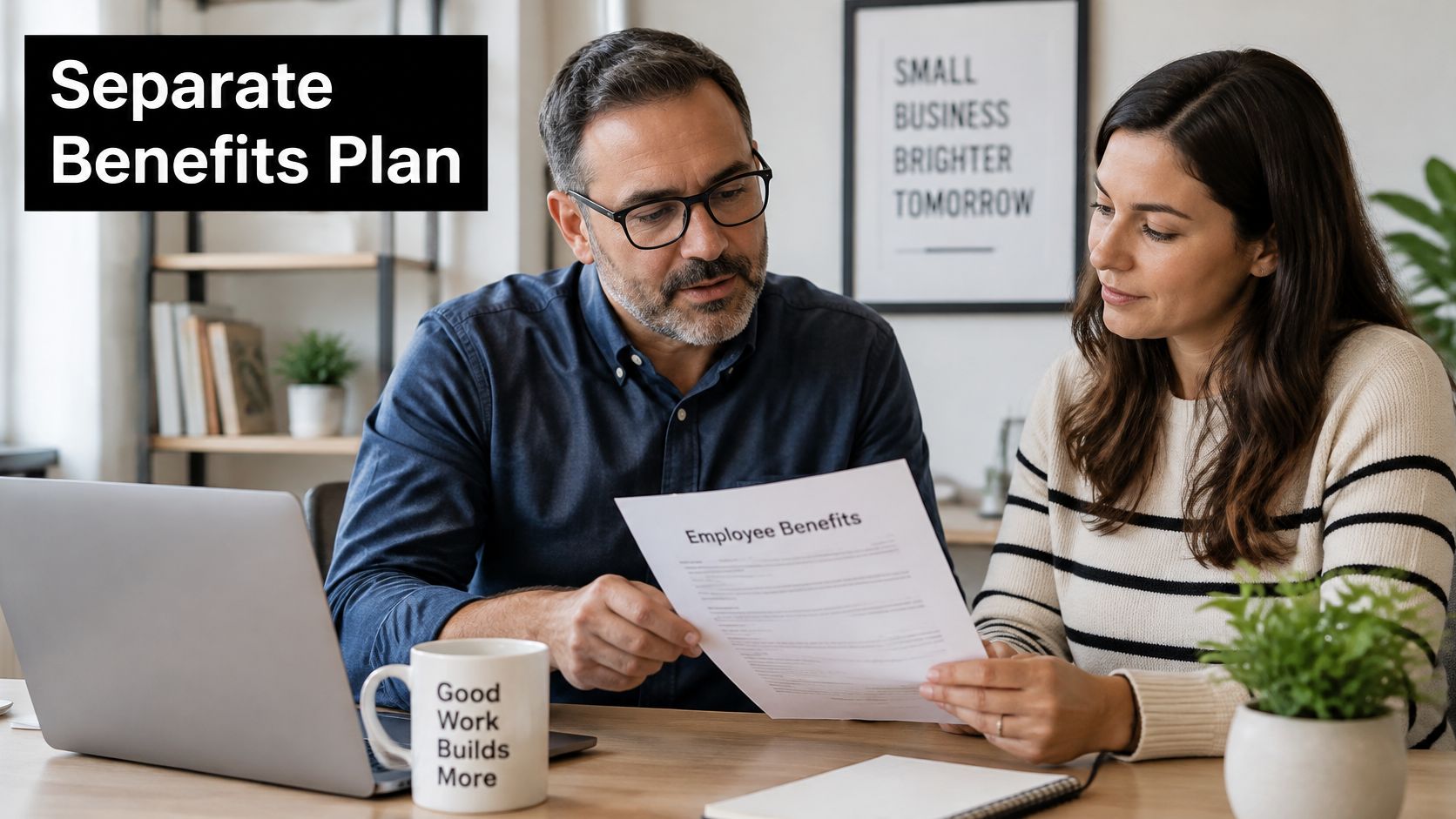 A professional man and woman review an employee benefits document together at an office desk.