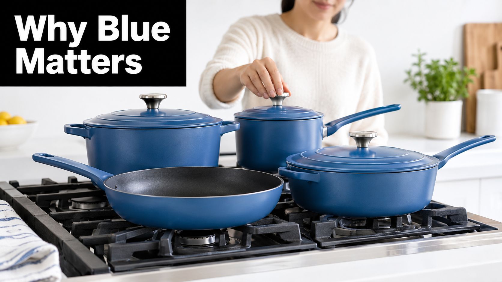 A woman prepares to cook using a set of modern blue pots and pans on a stove.
