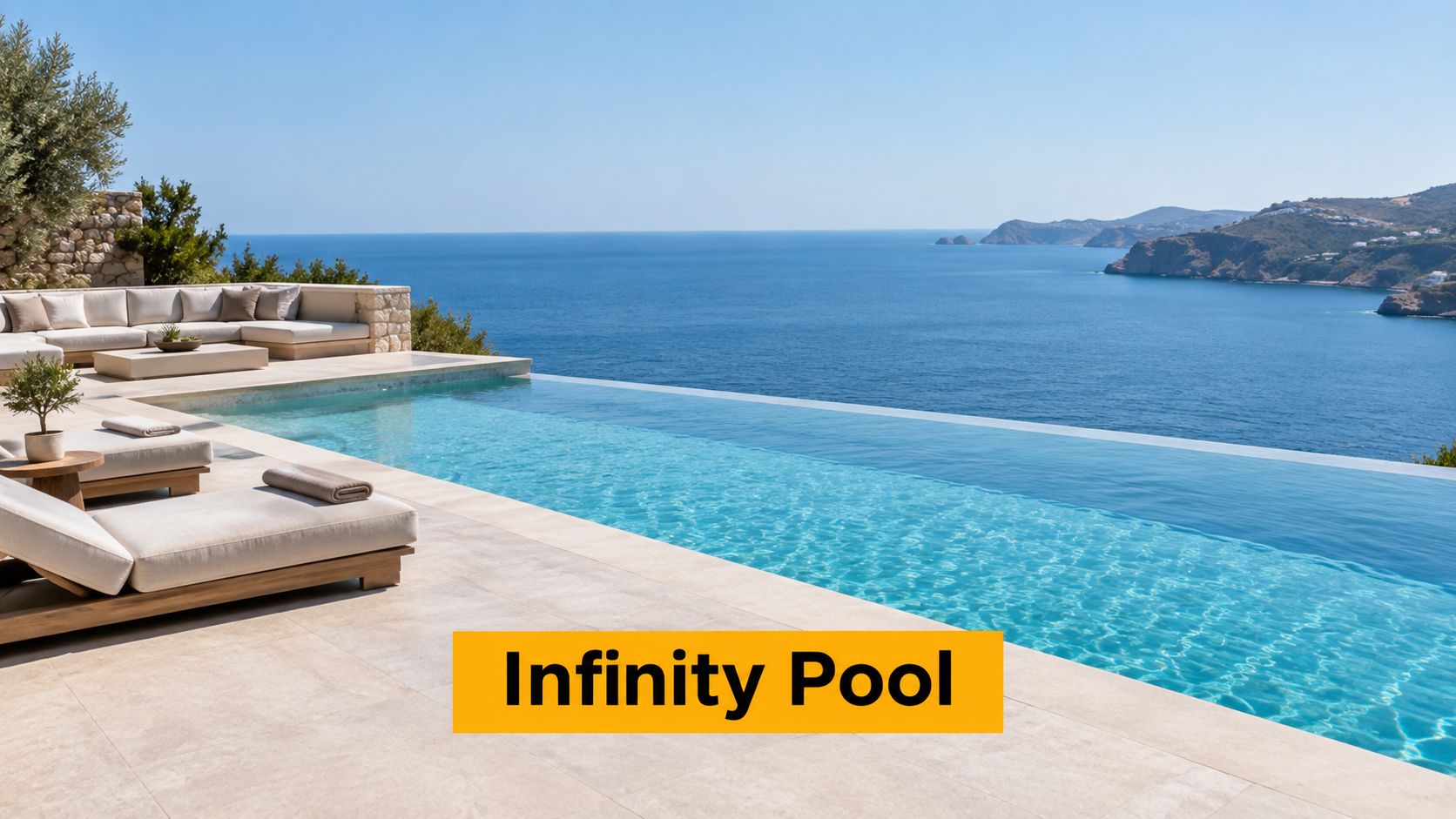 A stunning infinity pool overlooking the blue sea on a bright sunny day at a luxury villa.