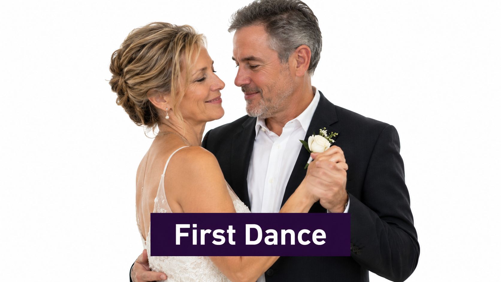 A middle-aged couple in wedding attire looking lovingly at each other while sharing a romantic dance.