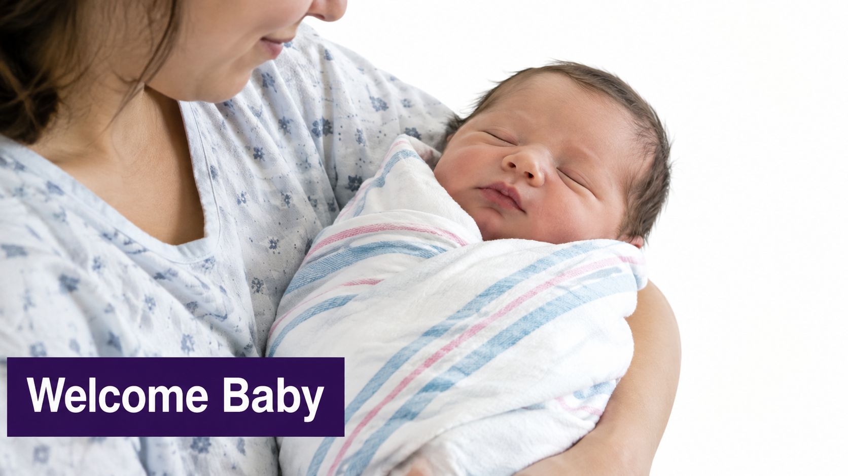 A newborn baby wrapped in a striped swaddle blanket being held by their mother