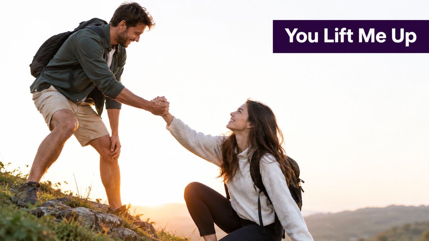 A man helping a woman climb a steep, sunny mountain trail during a hiking trip.