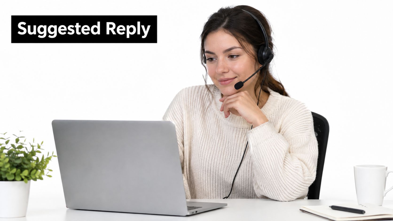 A friendly customer service representative wearing a headset while smiling at her laptop on a desk.