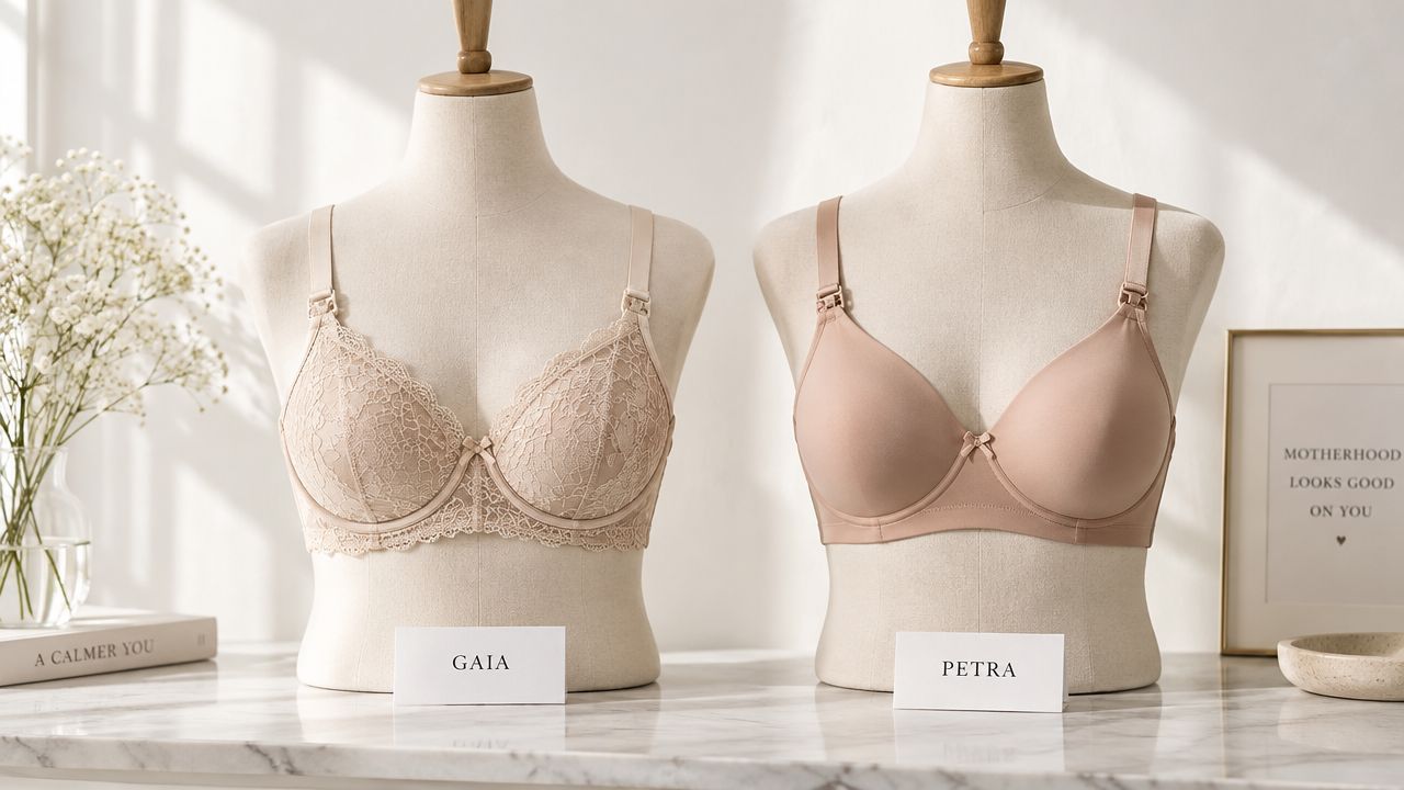 Two beige nursing bras displayed on mannequins, one lace and one smooth fabric, on a marble table.