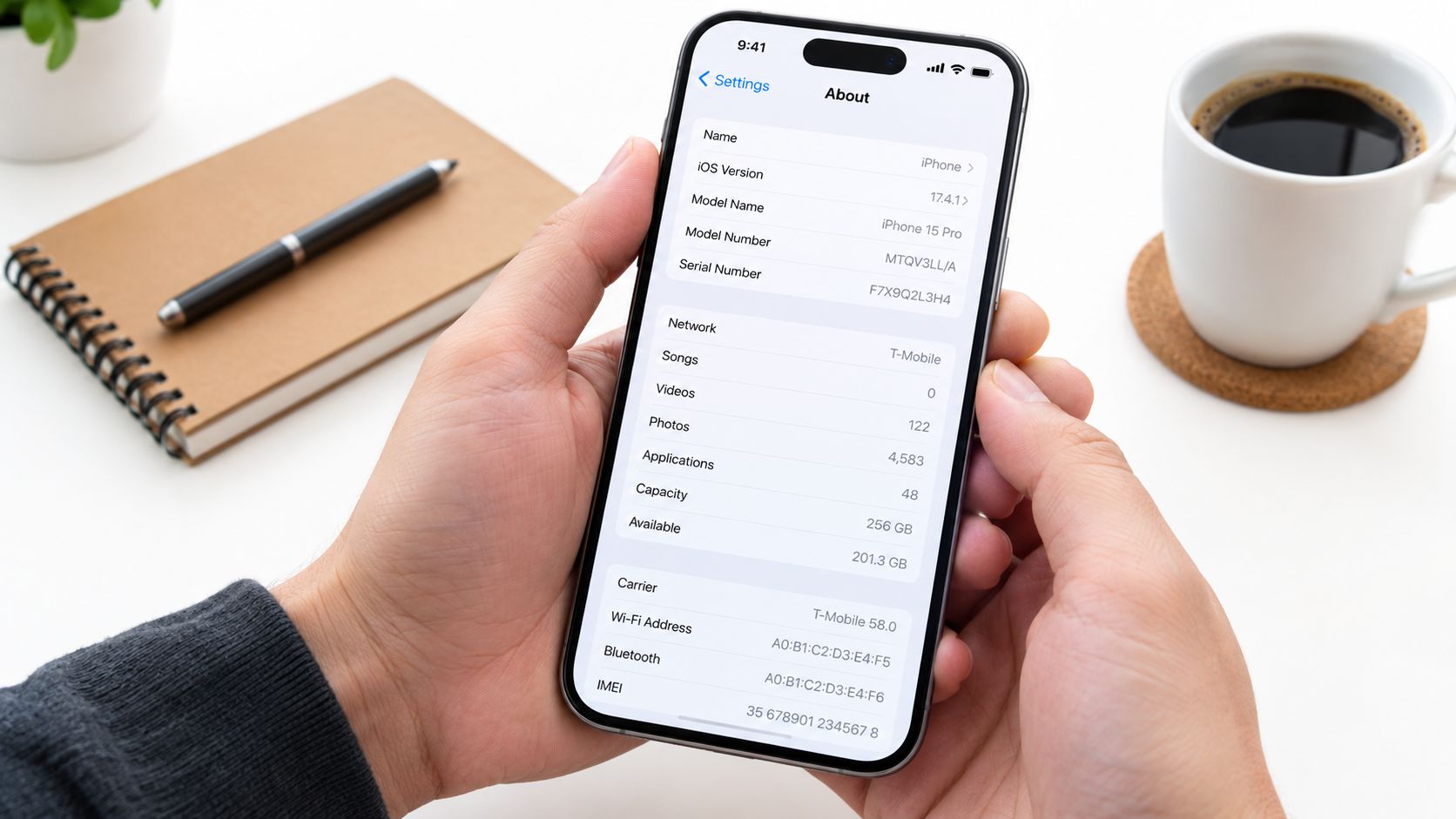 A person holds an iPhone 15 Pro displaying the About settings screen, showcasing device specifications and information.