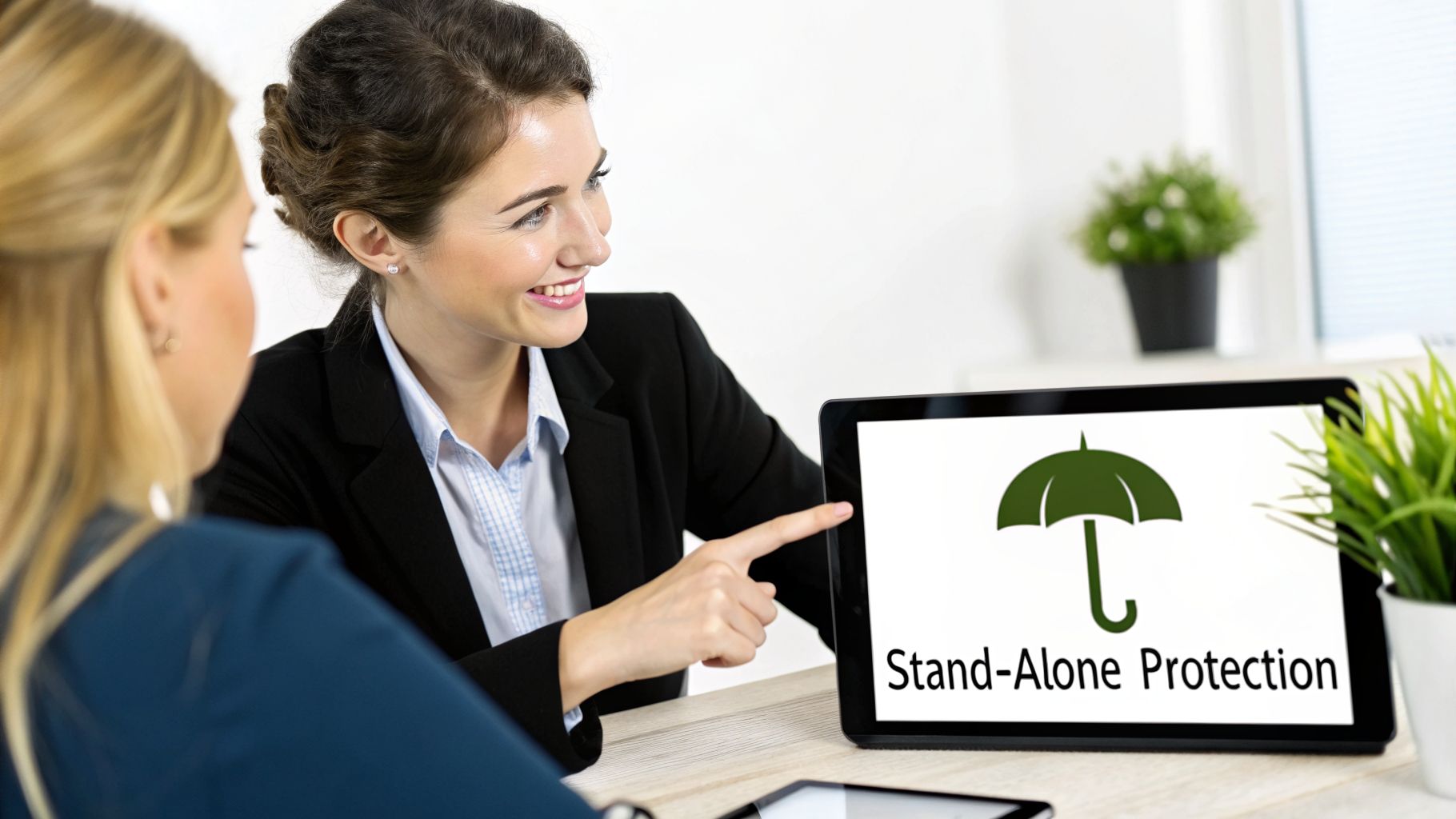 Businesswoman smiles, pointing at a tablet displaying 'Stand-Alone Protection' with an umbrella icon.