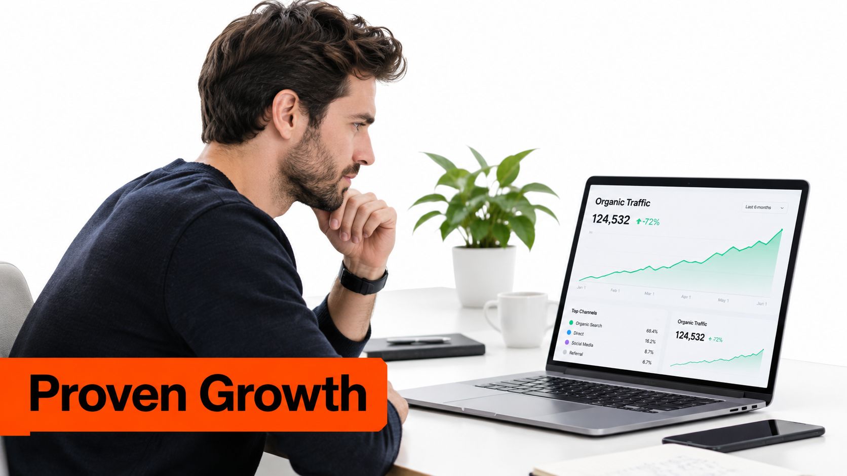 A professional analyzing website organic traffic growth metrics on a laptop screen while working at a desk.