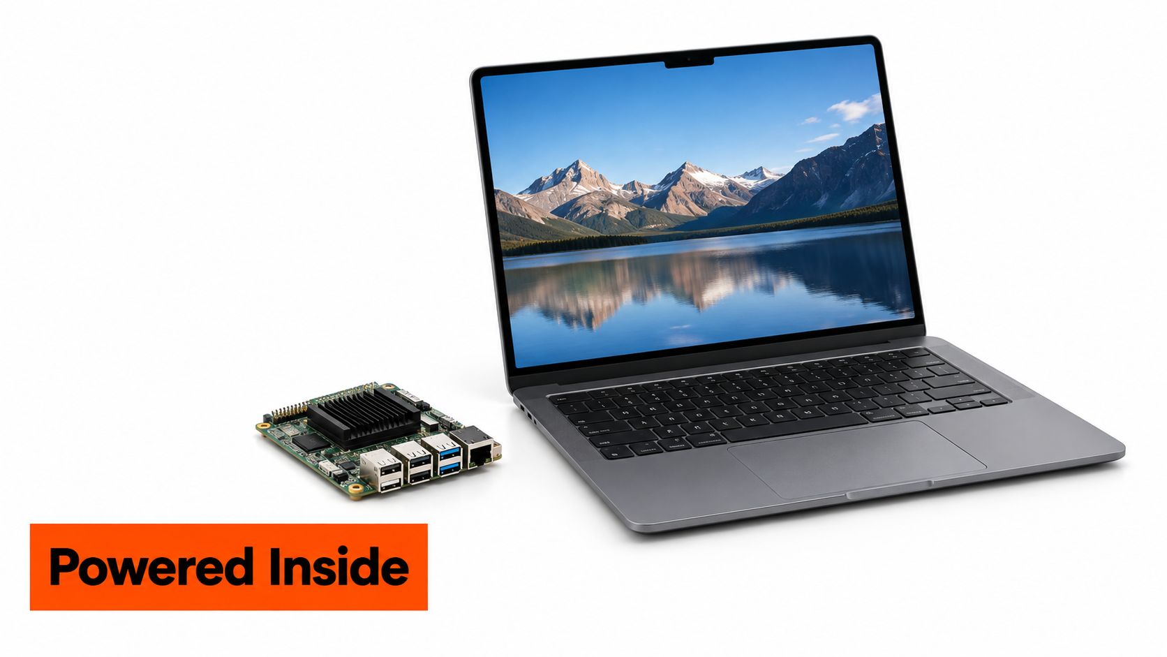 A single-board computer placed next to a sleek open laptop, highlighting internal hardware components.
