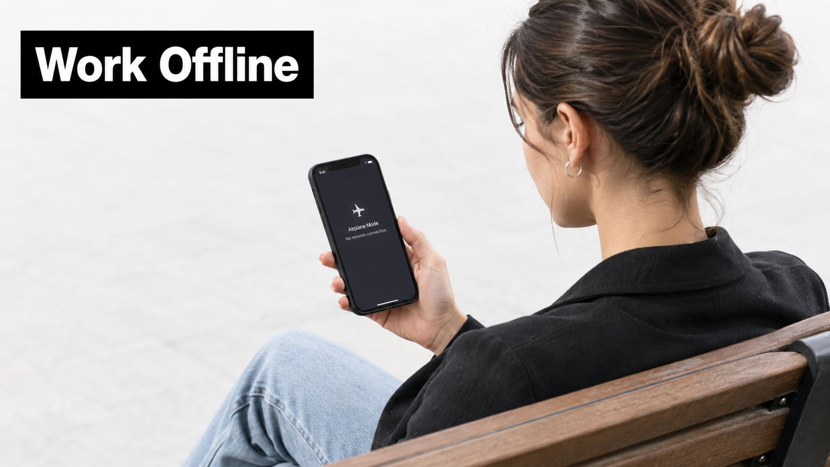 A woman sitting on a wooden bench holding a smartphone showing an airplane mode connection error message.