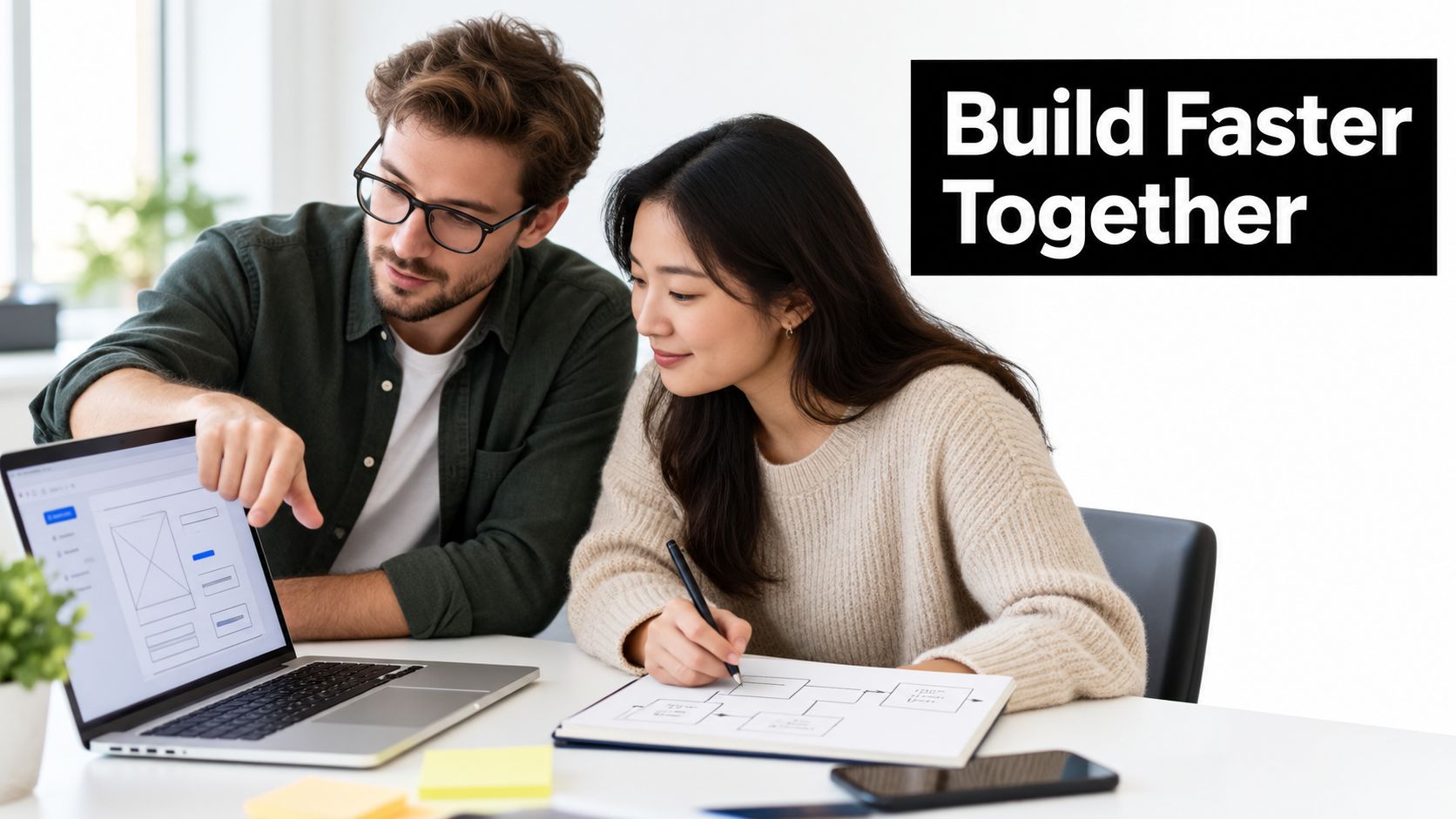 A man and woman collaborating on a software design project while looking at a laptop and drawings.