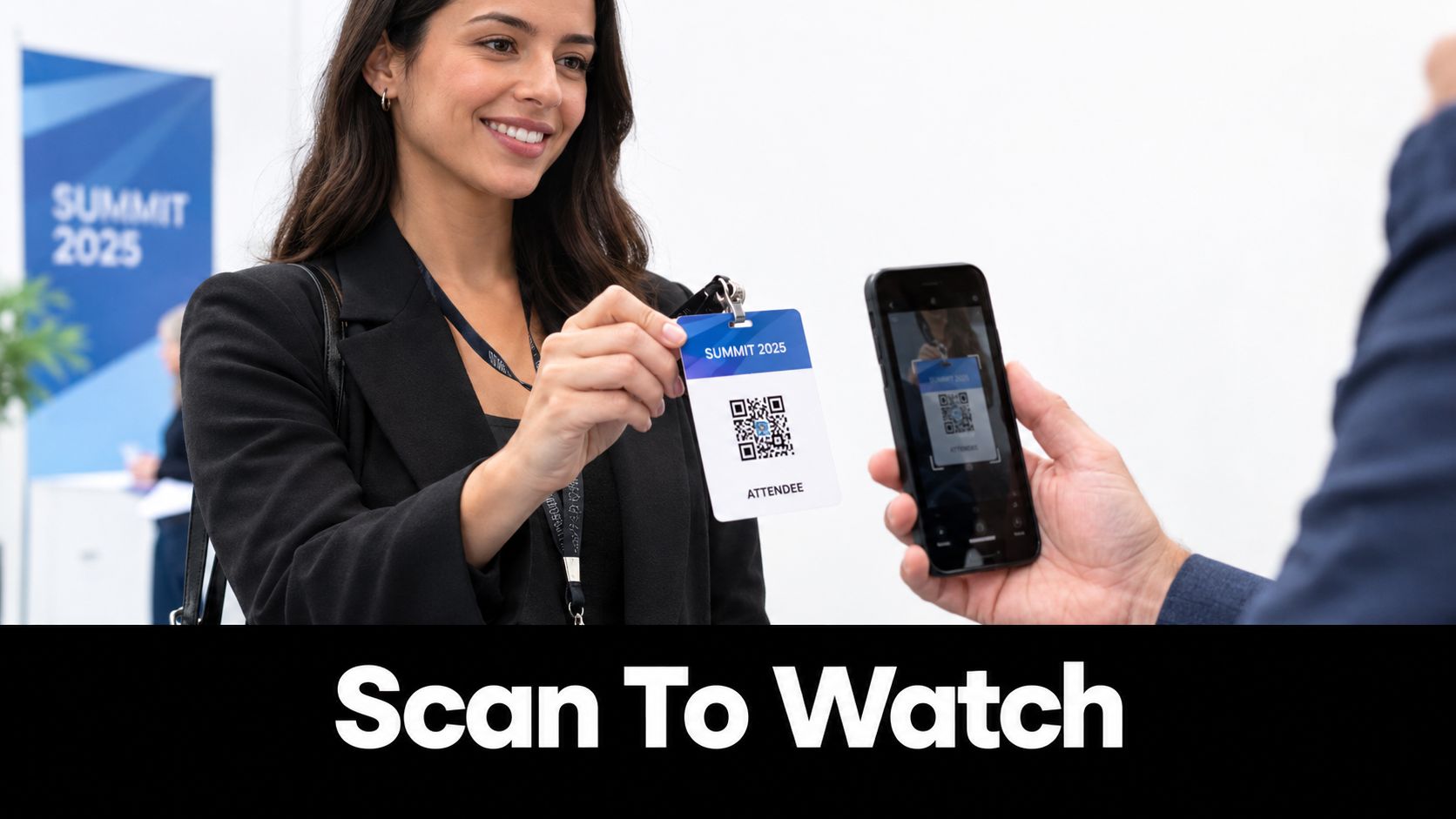 A woman holds up an attendee badge with a QR code to be scanned by a smartphone.